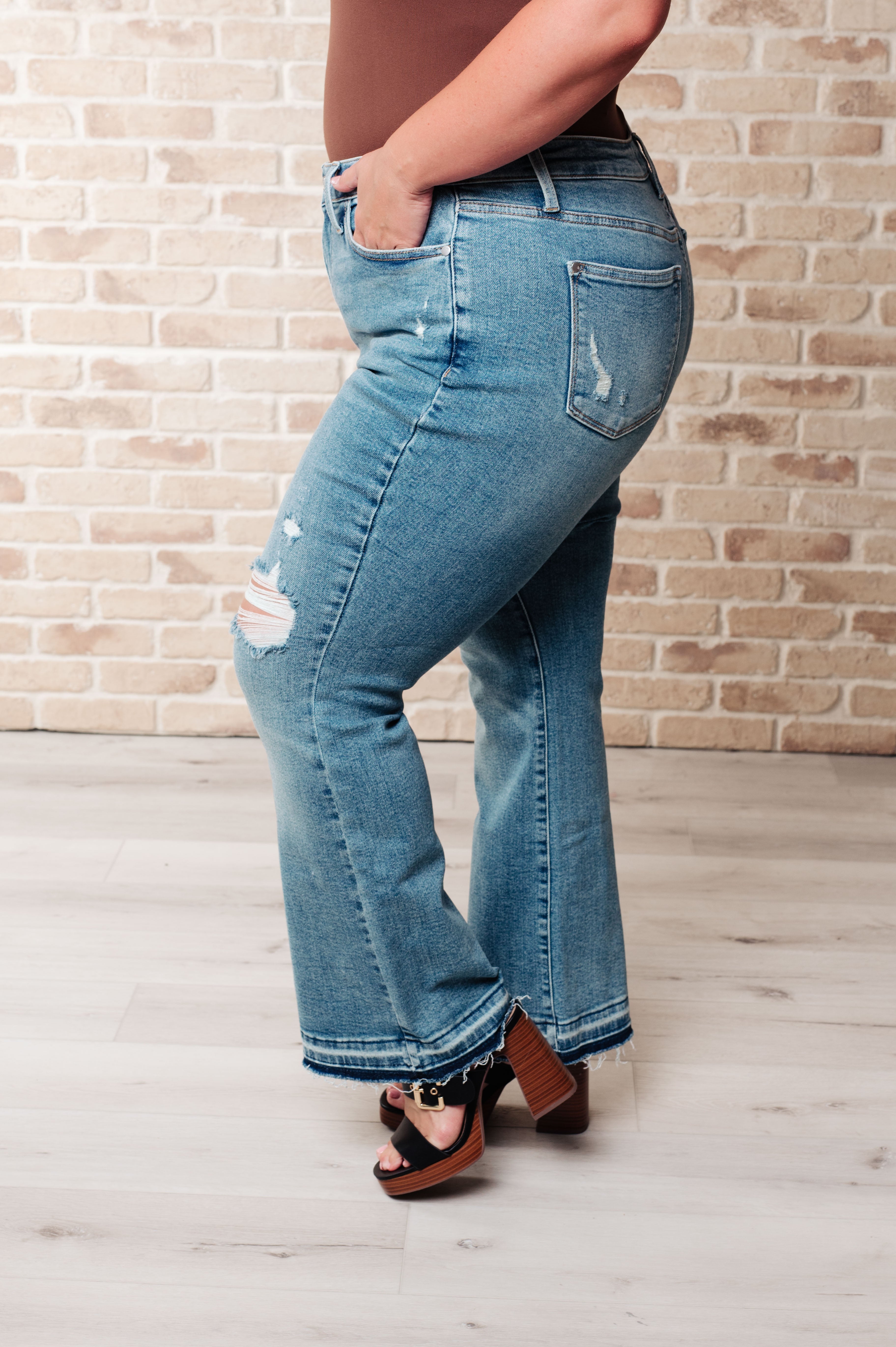 BeautybyShree Isla Mid Rise Distressed Released Hem Bootcut Jeans