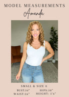 Model Amanda wearing white tank top and jeans, showing measurements: bust 34", waist 26", hips 38", height 5'6" - Small & Size 0