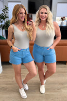 BeautybyShree Celeste Mid Rise Shield Pocket Cutoff Shorts in Sky Blue