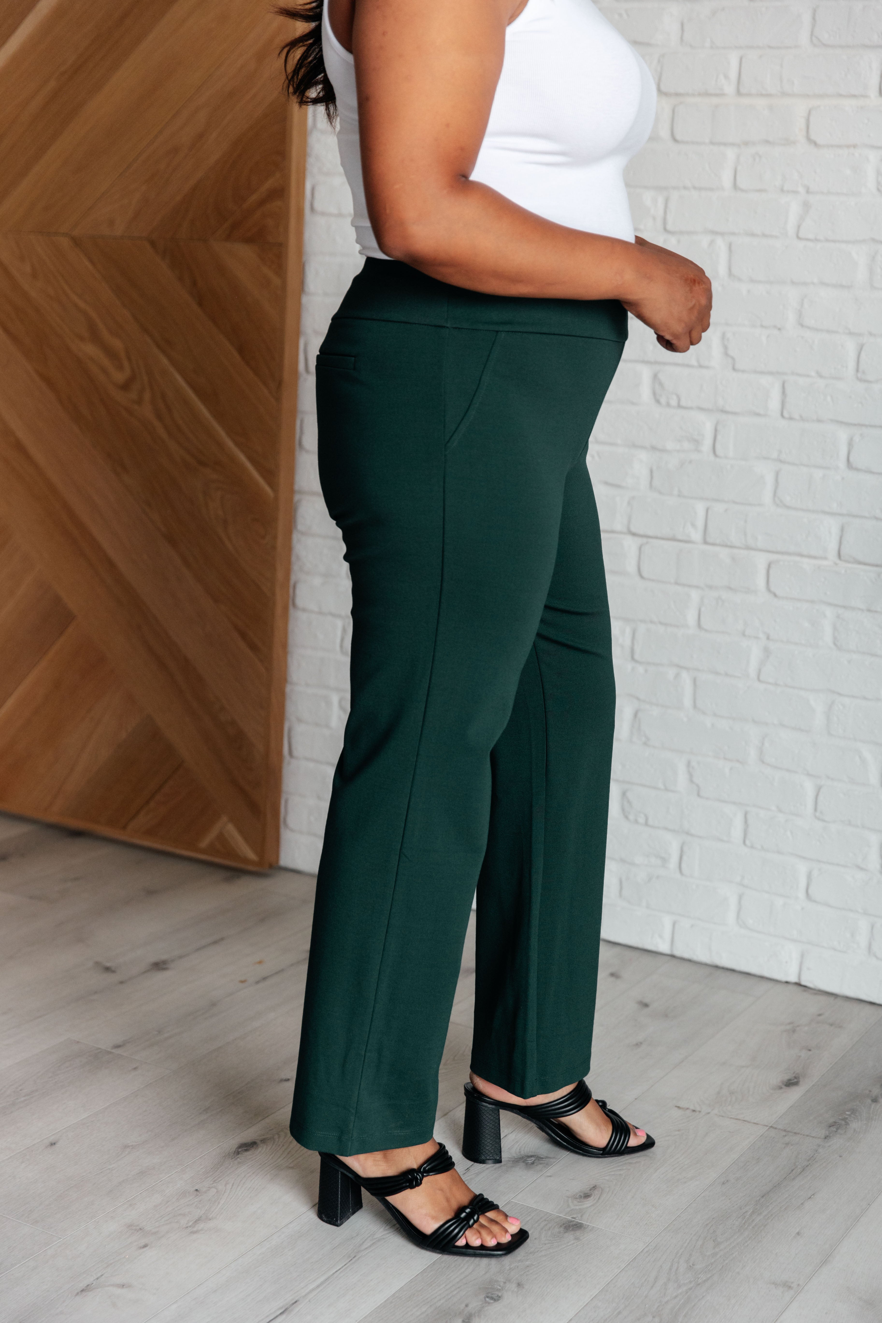 Woman wearing Magic Straight Pants in Hunter Green with elastic waistband and straight leg silhouette