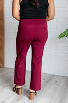 Back view of Magic Straight Pants in Wine, featuring faux welt pockets, straight leg silhouette, and ankle crop length.