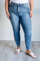 Woman wearing Nicole Tummy Control Skinny Jeans in Vintage Wash from Judy Blue, featuring high waist and faded skinny leg silhouette.