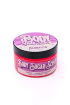 SugarGlowCo. Body Sugar Scrub Mesmerized, *Almost Perfect, with vanilla, sweet cherry, and coconut flavorings in a vibrant red container.